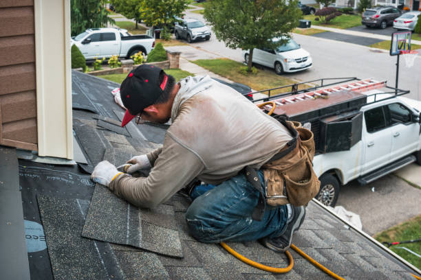 Professional Gutter Repair And Installation technician working in Milroy, IN
